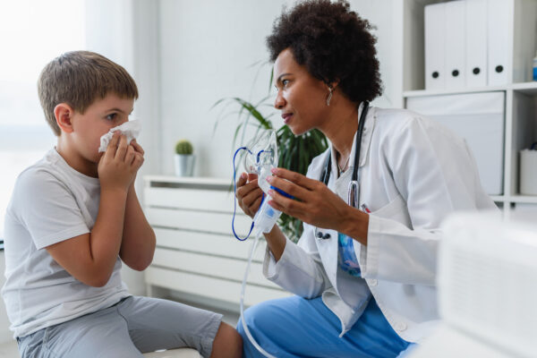 pediatrician taking care of sick child